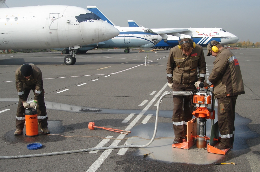 Taking core samples of airfield pavements